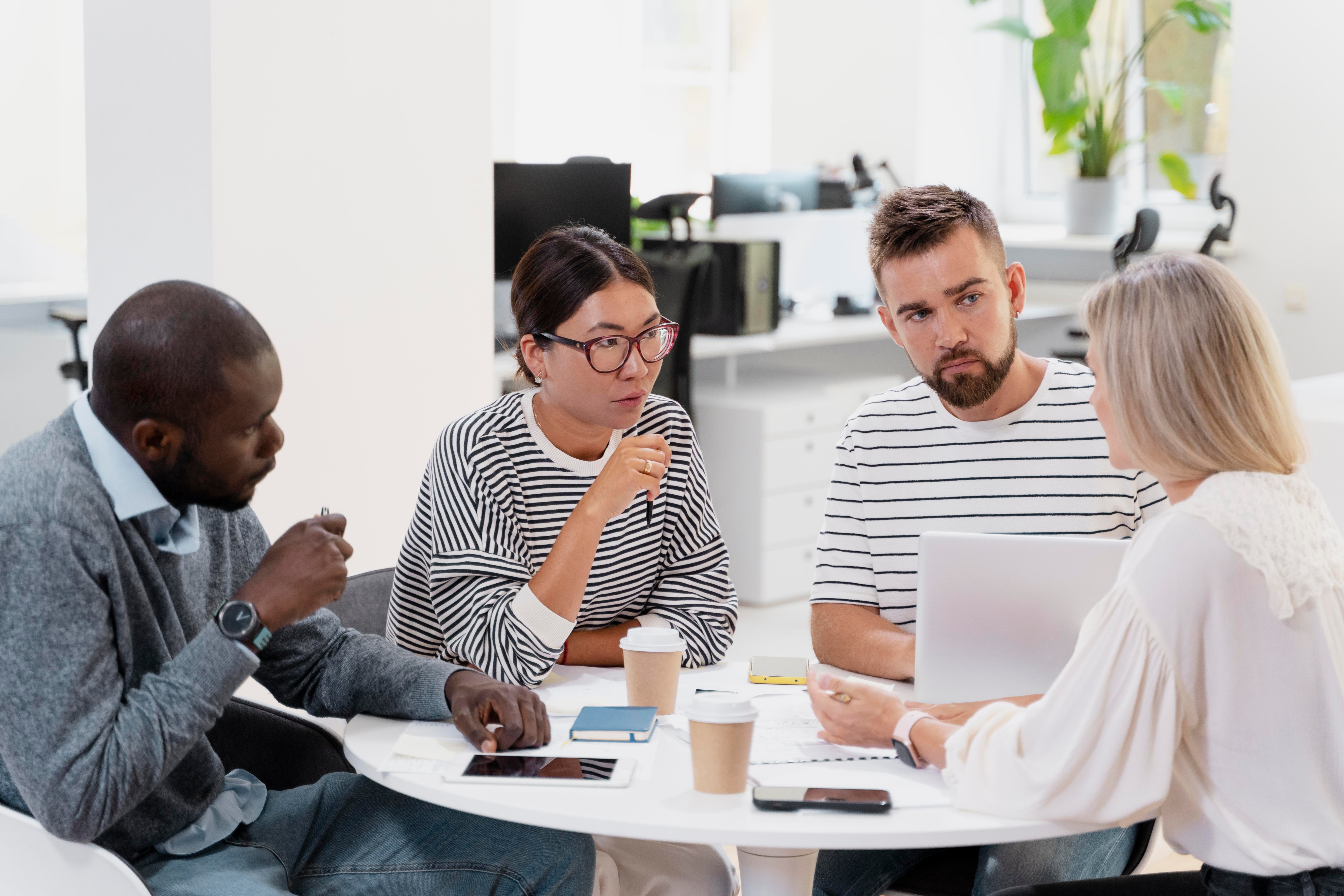 close-up-young-colleagues-having-meeting
